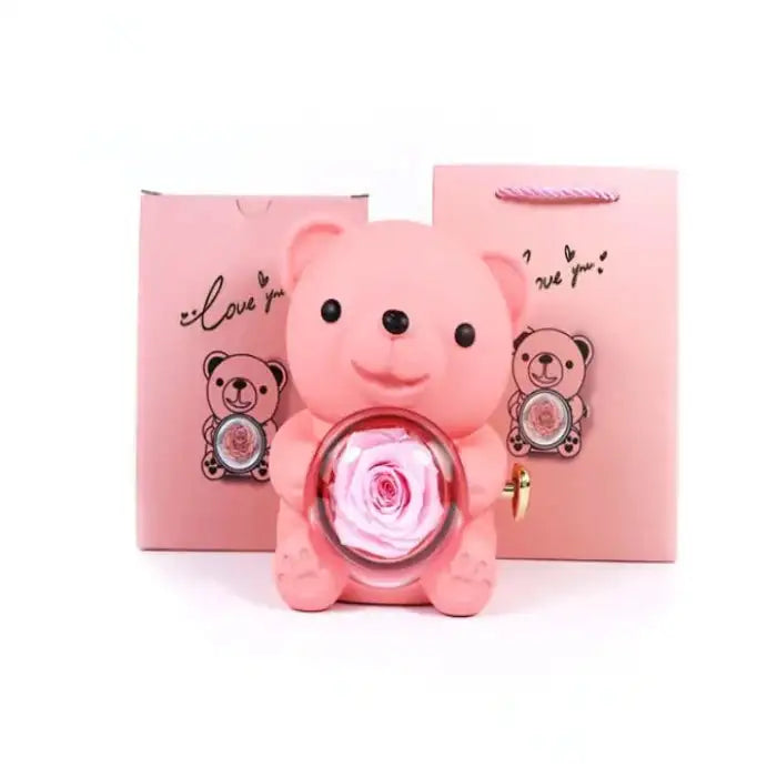 Romantic Teddy Red Bear With Preserved Rose Real Rose in Elegant Box - MaribelaShop2 This beautifully crafted jewelry box features a delightful bear design that rotates, revealing a compartment adorned with exquisite roses. Perfect for storing small treasures or as a decorative keepsake, this box makes an ideal gift for special occasions like birthdays, anniversaries, or Valentineās Day. Its compact design and intricate details ensure itās a standout piece that brings joy and elegance to any space.(Zdr)