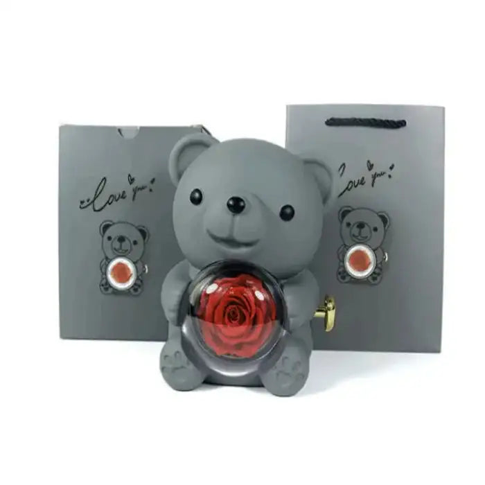 Romantic Teddy Red Bear With Preserved Rose Real Rose in Elegant Box - MaribelaShop2 This beautifully crafted jewelry box features a delightful bear design that rotates, revealing a compartment adorned with exquisite roses. Perfect for storing small treasures or as a decorative keepsake, this box makes an ideal gift for special occasions like birthdays, anniversaries, or Valentineās Day. Its compact design and intricate details ensure itās a standout piece that brings joy and elegance to any space.(Zdr)